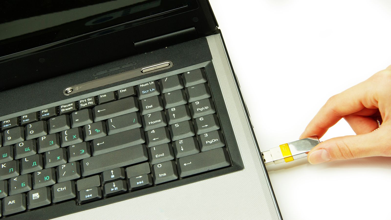 USB drive and a printed checklist on a clean workbench